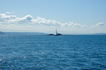 Sail boat on Puget Sound as seen from ferry