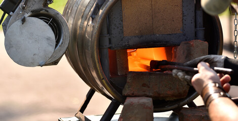 a furnace in the forge where the steel detail is heated 