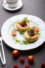 Donuts with duck pate and jam served for lunch
