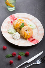 Donuts served with ice cream, fruits and cheese