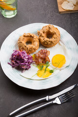 Donuts with peanut butter served with fried eggs