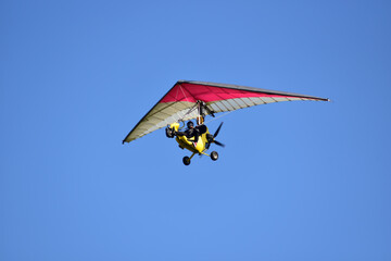 Motor kite flying in the sky - obrazy, fototapety, plakaty