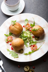 Middle eaterns fried donuts served with avocado