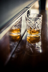 Whisky glass on a wooden surface