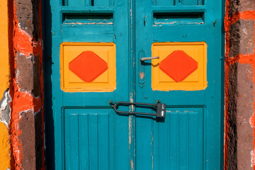 Architecture of doors of Oia village on Santorini island, Greece