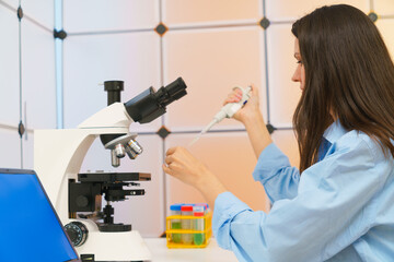 Young woman in a science lab. Health care researchers working in life science laboratory.