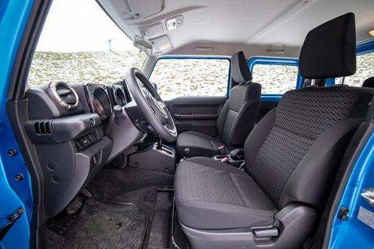 Moscow, Russia - January 24, 2020: Empty interior of new mini SUV Suzuki Jimny Static Photos in winter forest. close-up.
