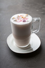 Glass cup of babyccino drink with marshmallows