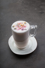 Glass cup of babyccino drink with marshmallows