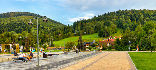 Panoramic view of St. Jacob square, plac Sw. Jakuba, in Szczyrk mountain resort of Beskidy...