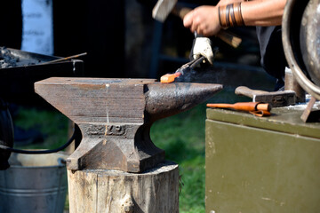 forging damascus steel by hand on the anvil 