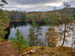 Lake in the rocks. Autumn hike. Autumn landscape.