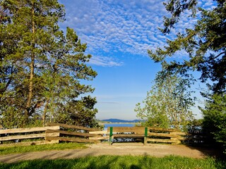 Bench overlooking the ocean shore in the park in Central Saanich, BC