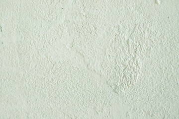 The texture of the putty or paint. Rough, uneven background.
