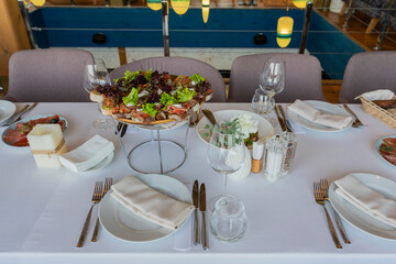 Served table in a restaurant for a holiday, serving a banquet table