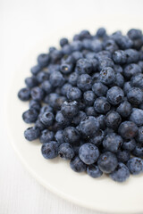 blueberries on a white plate