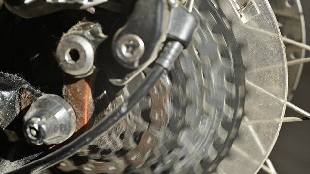 A close-up of the gears of a multi-speed bike