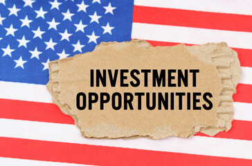 On the US flag lies a cardboard box with the inscription- INVESTMENT OPPORTUNITIES