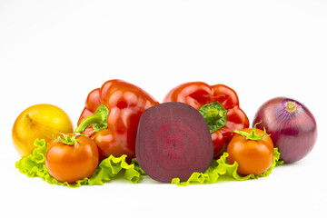 An assortment  of vegetables is isolated on a white background.