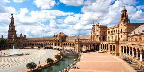 Panoramic view of the Plaza de Espana in Seville in Spain. One of the most spectacular monuments in the world and one of the best buildings of Andalusian regionalism. - obrazy, fototapety, plakaty