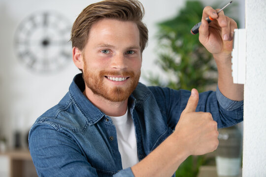 handsome man showing thumb up