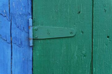 Old wooden green and blue door