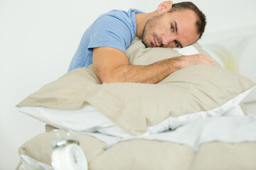 man holding a pillow