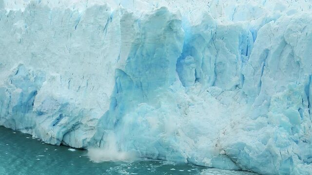 Action of piece of Perito Moreno Glacier breaking and falling in water, Los Glaciares National Park, Santa Cruz Province, Patagonia, Argentina, South America, 4k footage in slow motion