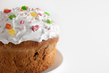 Easter cake close up. Traditional cake or sweet bread with raisins and meringue on a white background