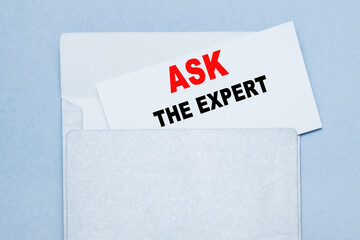Text ASK THE EXPERT on white paper at envelope. business concept