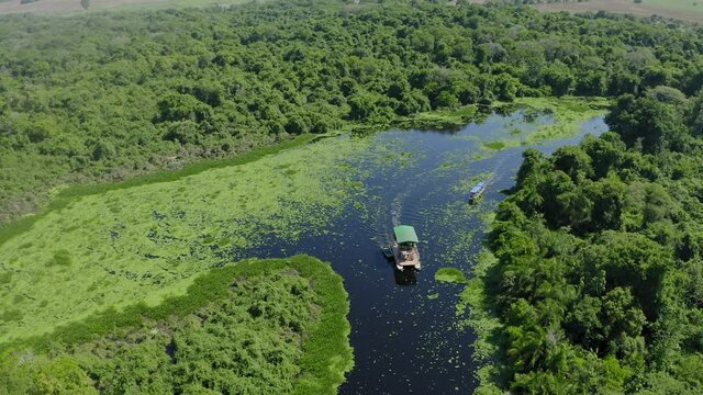 aerial image with boat drone on a river in the middle of the Pantanal Mato Grosso do Sul Brazil