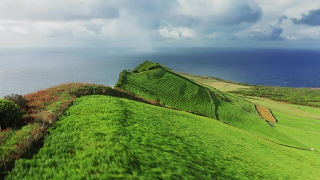 Sao Jorge, Azores, Portugal. Drone footage of the island with indented coastline with an oblong shape. An unforgettable panoramic view over the cliff washed with the Atlantic. High quality 4k footage