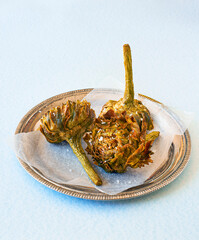 Roman fried artichokes Jewish style seasoned with flakes of kosher salt. Italian cuisine. - 427704930