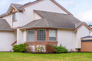 Fragment of a luxury house with entrance door and nice window.