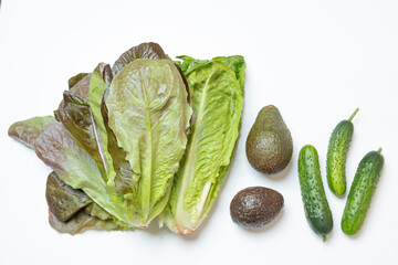 Set for green salad: romaine lettuce, avocado and cucumber. Concept - healthy diet plant based.