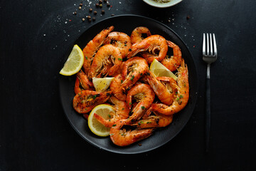 Shrimps with spices on plate