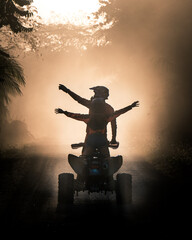 Silhouette of friends driving quad bike at sunset © CapturandoKilometros