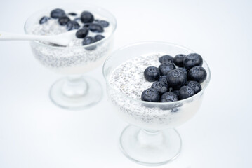 Healthy breakfast with yogurt, chia seeds and blueberry. Vegan food