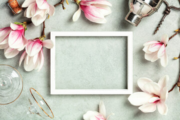 Photo frame mock up with space for text, beautiful spring magnolia flowers, Cocktail Shaker and...