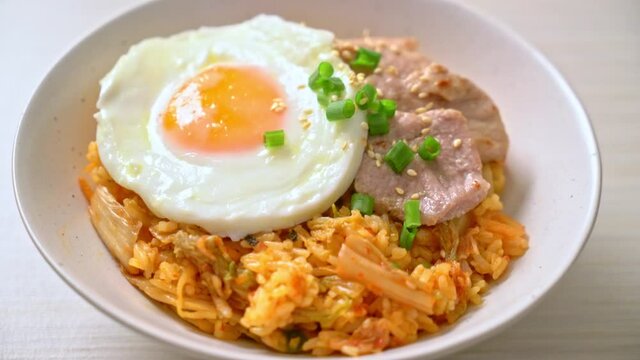 Kimchi fried rice with fried egg and pork - Korean food style