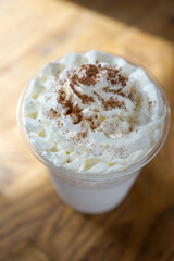 Chocolate milkshake sprinkled with cocoa