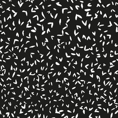 Black and white strokes lines abstract seamless repeat pattern. Random placed elements all over print with black background.