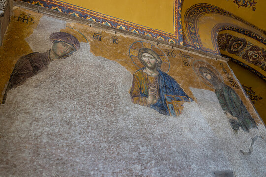 Istanbul, Turkey - October 9, 2019: Deesis mosaic in Hagia Sophia located in the upper southern gallery on the western wall dates from 1261. Jesus Christ with the Virgin May and John the Baptist.