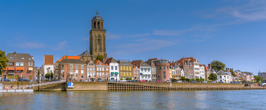 Deventer, The Netherlands - August 27 2016: Dutch city Deventer  skyline panorama view with the Great Church of Lebuines along side the IJssel river