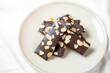 crunchy brittle brownie crisps crackers set on white cafe table.