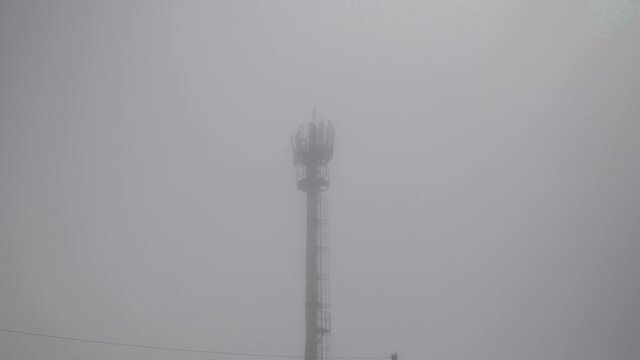 Transmission Tower In A Thick Fog.