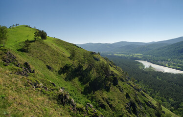 Fototapeta premium Mountain river stream valley among green hills rocks Altai mountains, Siberia, Russia