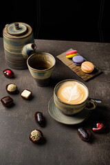 Obraz na płótnie Canvas cup of cappuccino with desserts