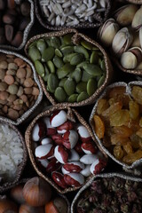 pine nuts in their shells scattered on a wooden table