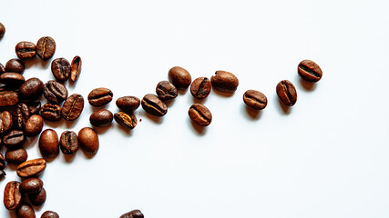 coffee beans lie on a white background.